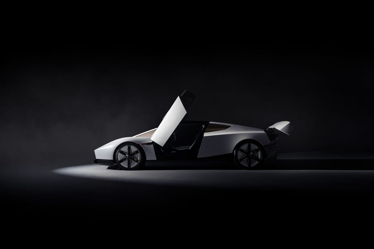 The next-generation Tesla Roadster in profile with its door raised