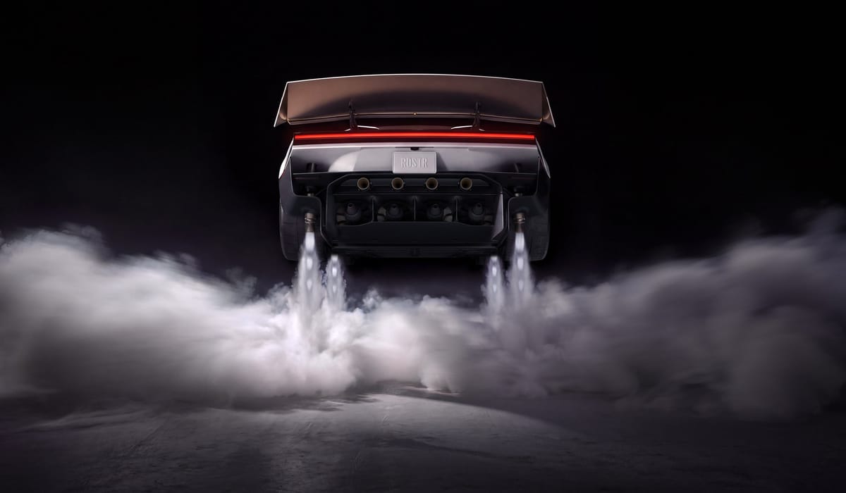 Rear view of the Tesla Roadster with four jets of gas firing downward into a low cloud of vapor