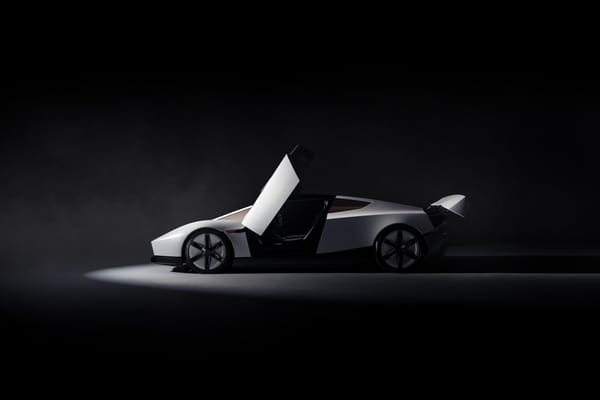 The next-generation Tesla Roadster in profile with its door raised
